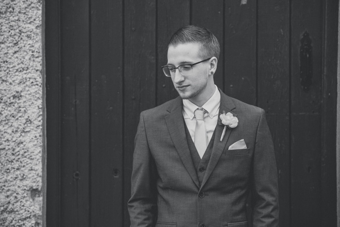 black and white groom portrait