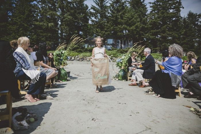 flower girl walking down the aisle