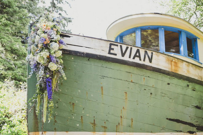 wooden boat decorated with wedding flowers