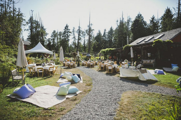 outdoor wedding reception with blankets and pillows