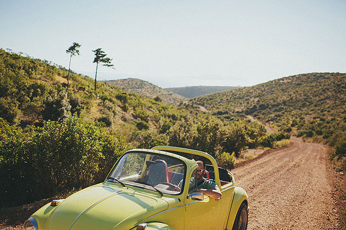 groom in vintage green car