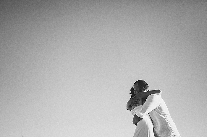 bride and groom hugging