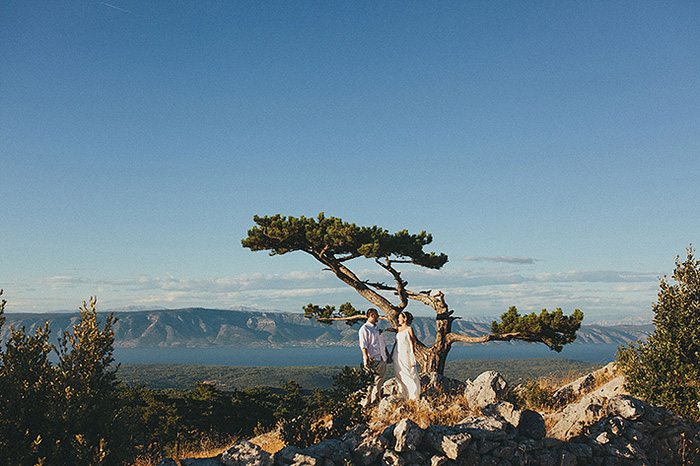 bride and groom under croatian tree