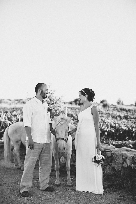 bride and groom portrait with horse