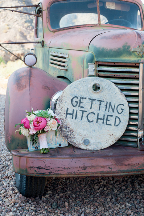 getting hitched sign on old truck in desert