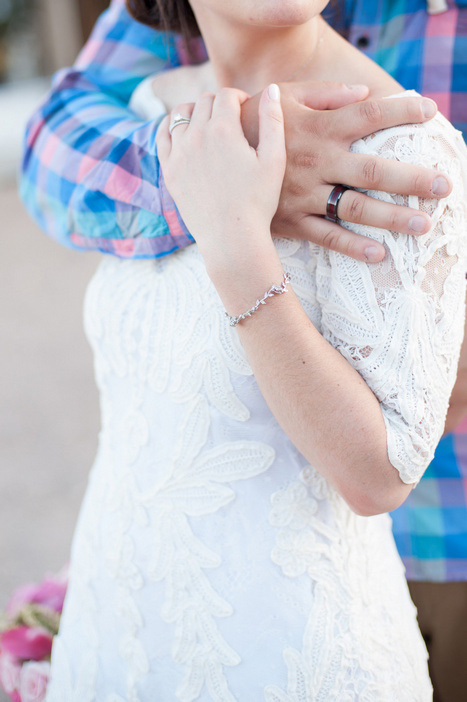 close-up of bride and groom's hands