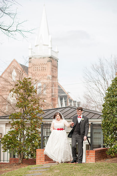 bride and groom walking on property