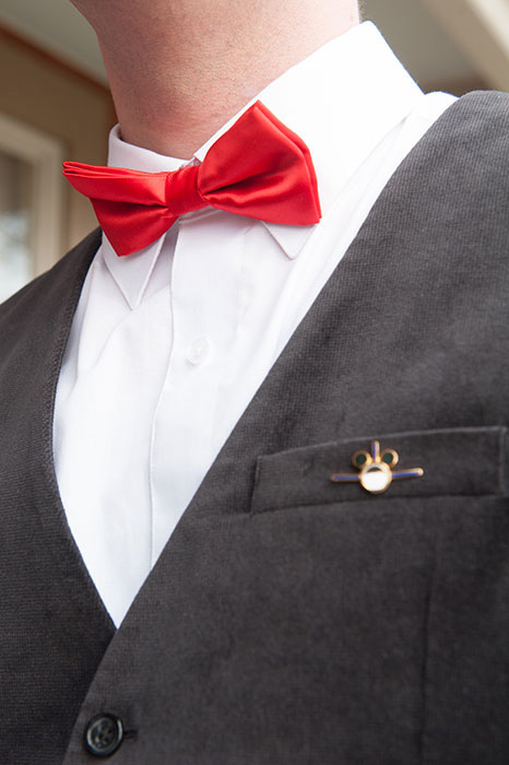 groom wearing red bow tie