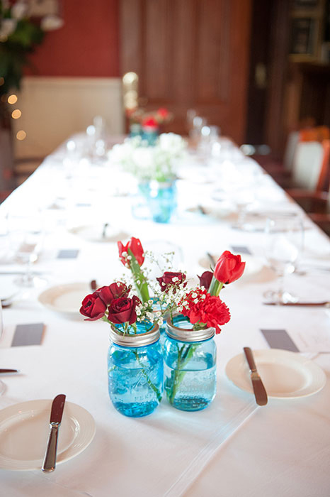 red flowers in blue jar