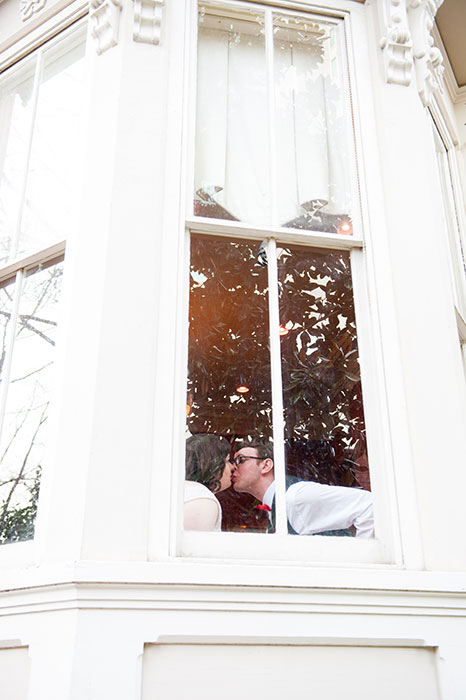 bride and groom kissing at reception