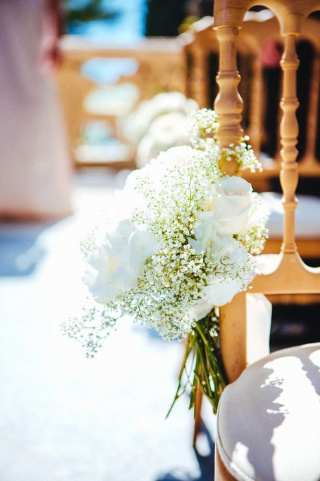 flowers on ceremony chairs