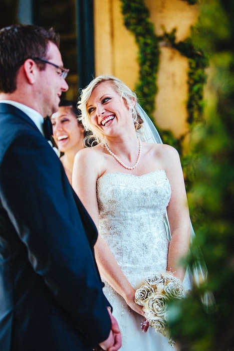 bride laughing during ceremony