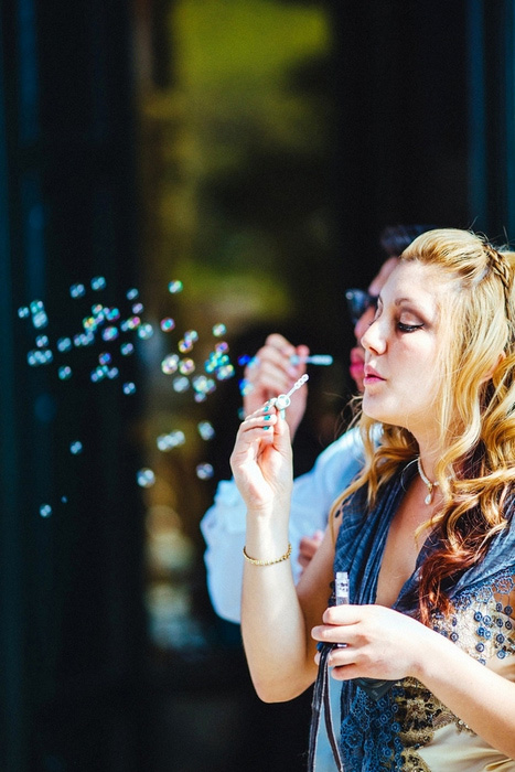 wedding guest blowing bubbles