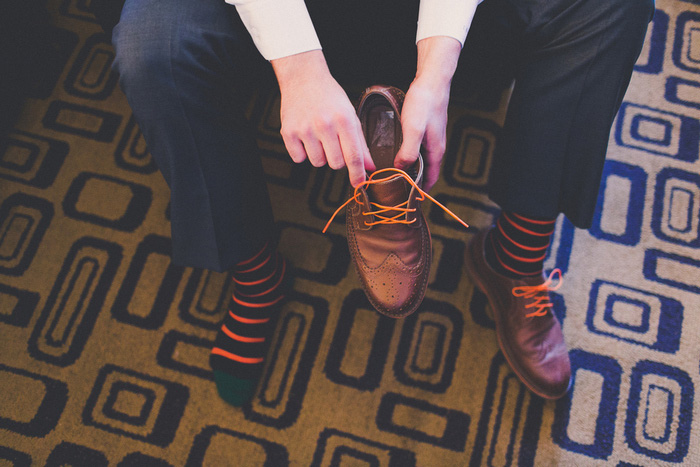 groom putting on shoes