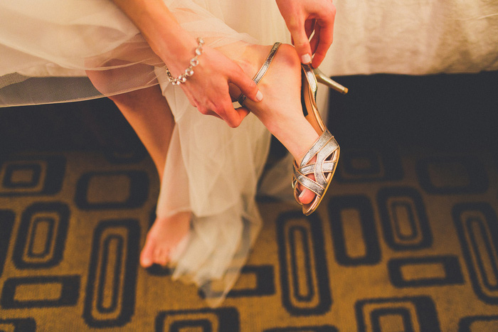 bride putting on shoes