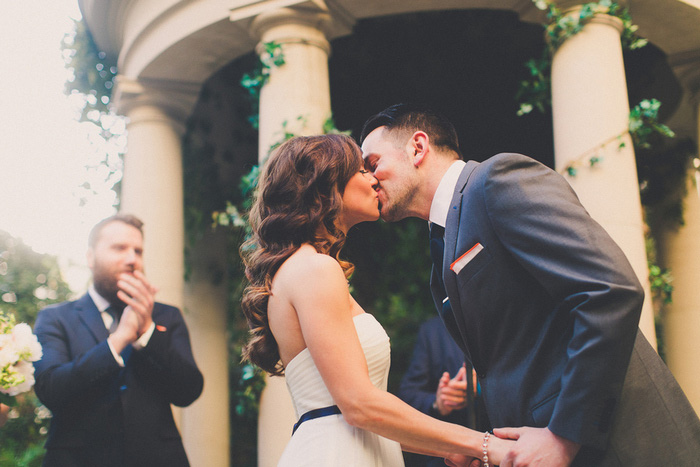 bride and groom first kiss