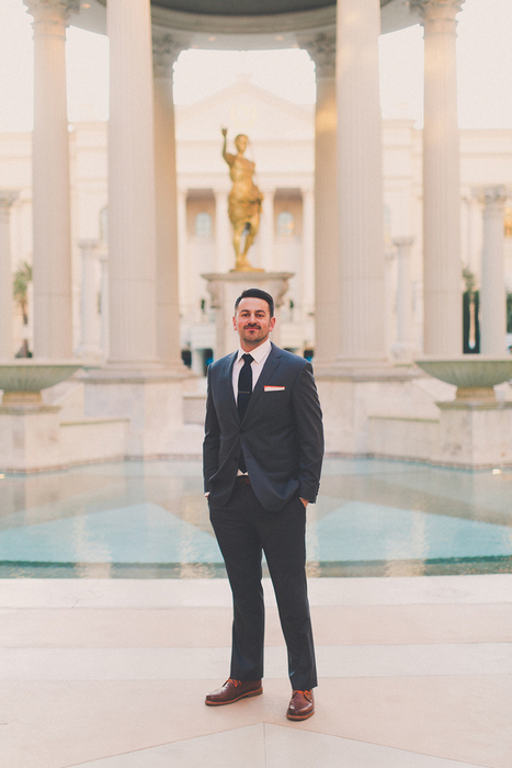 groom portrait by the pool