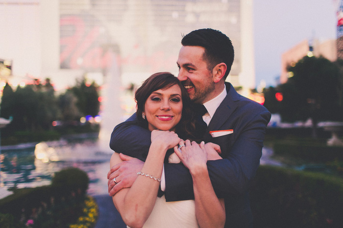 groom hugging bride