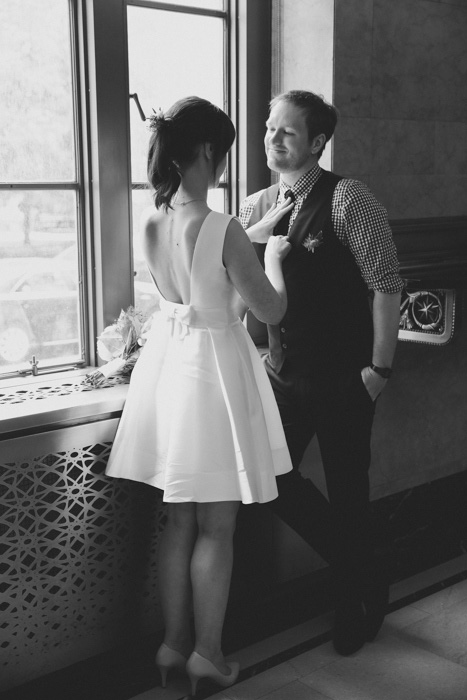 bride adjusting groom's tie