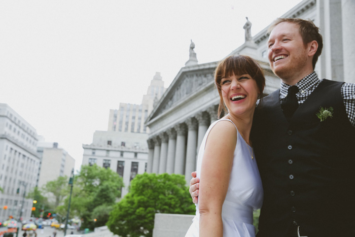 bride and groom in front of New York City Hall