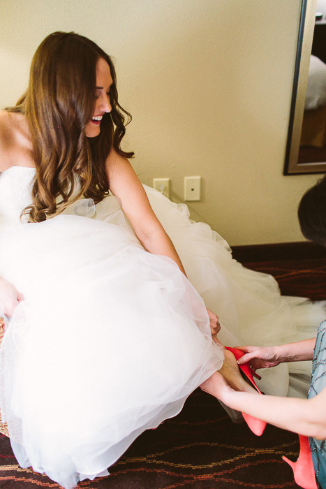 bride putting on shoes