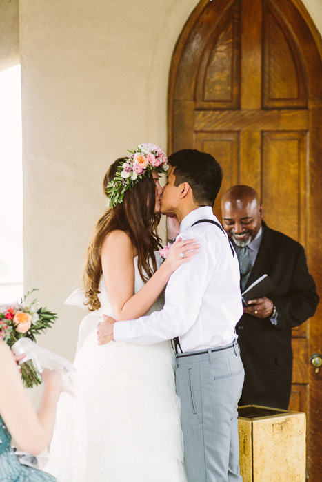 bride and groom first kiss