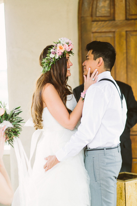 happy bride and groom at the altar