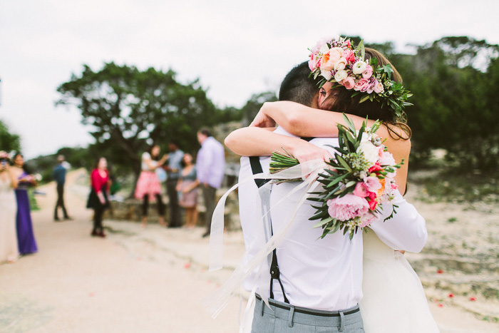 bride and groom hgging tightly