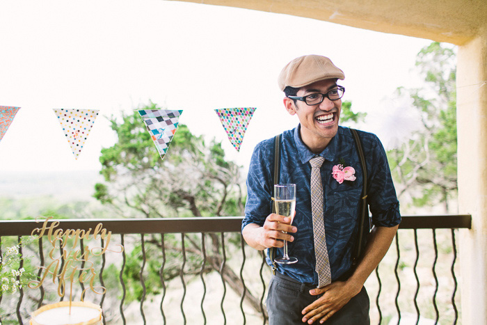 laughing groomsman with chapagne