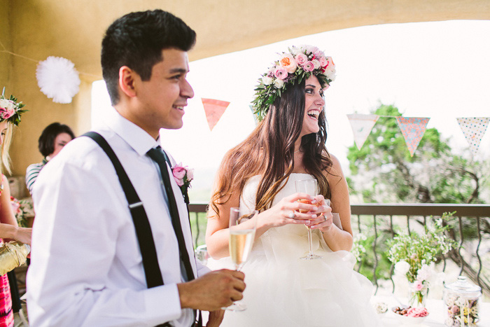 bride laughing with groom during reception