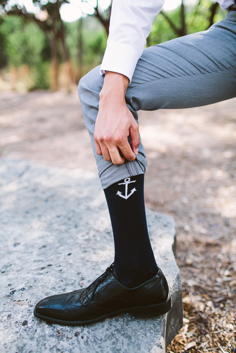 groom wearing anchor socks