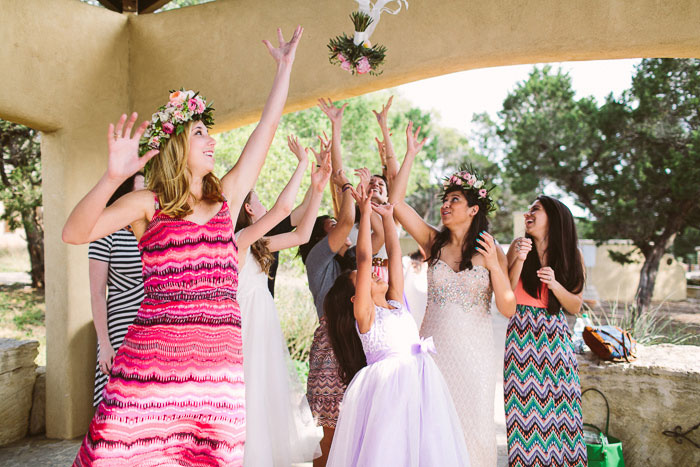 wedding guests catching the bouquet