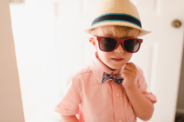 ring bearer in bow tie and wayfarers