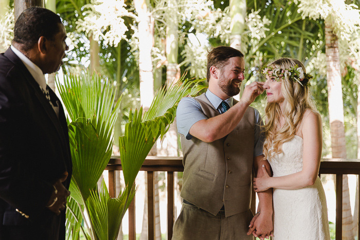 groom wiping away bride's tears