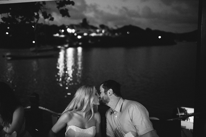 bride and groom kissing at wedding reception