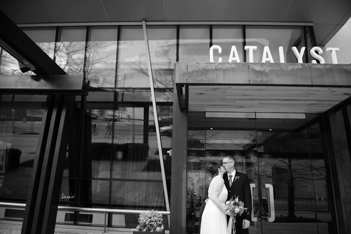 bride and groom outside Catalyst restaurant