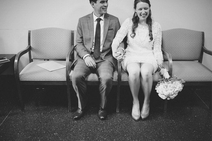 bride and groom waiting at the courthouse