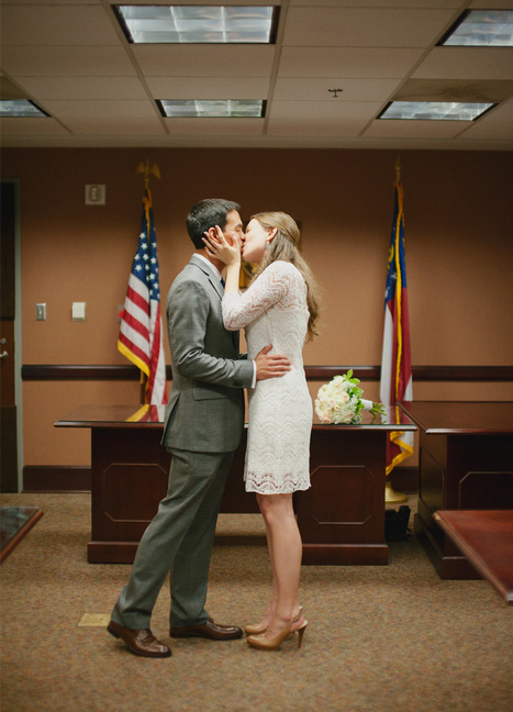 bride and groom first kiss