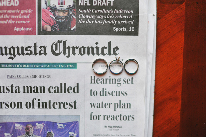 wedding rings on newspaper