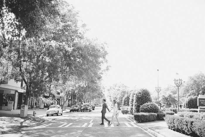 bride and groom crossing the street