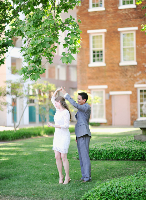 bride and groom dancing outside courthouse 