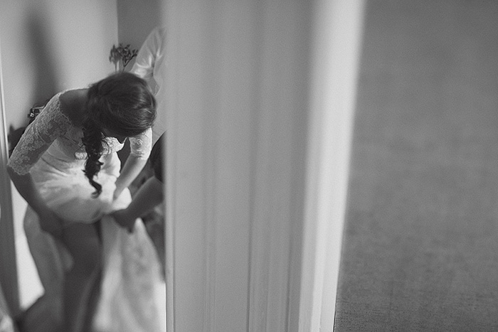 bride adjusting her garter