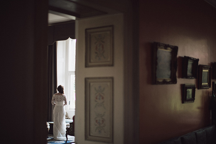 bride standing by window