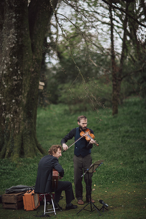 violinist at outdoor wedding wedding ceremoy