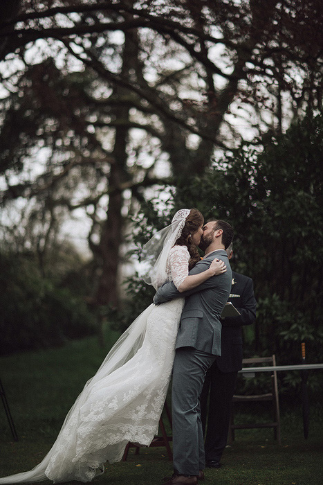 bride and groom first kiss