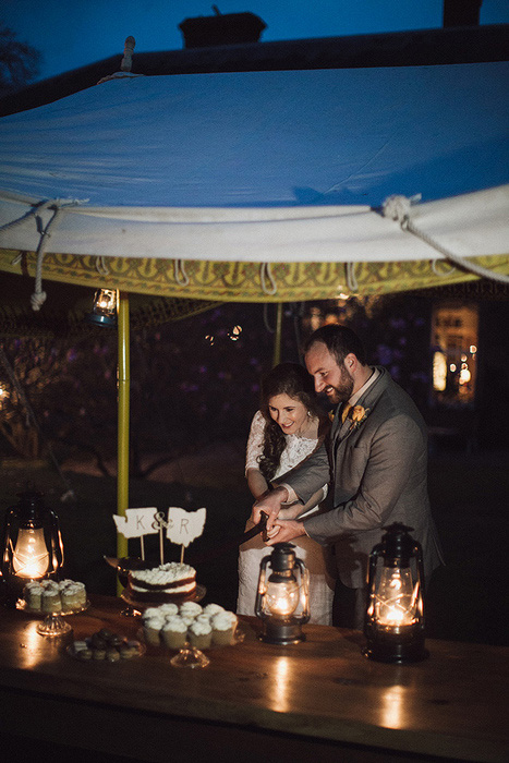 bride and groom cutting the cake