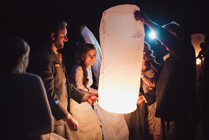 bride and groom releasing a wish lantern