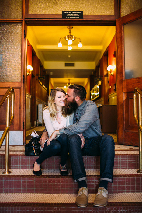 bride and groom kissing on courthouse steps