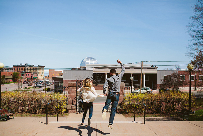 couple jumping off steps