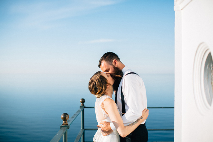 bride and groom first kiss